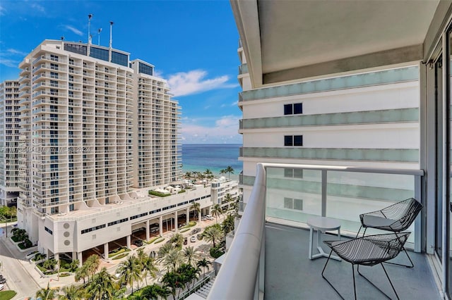 balcony featuring a water view