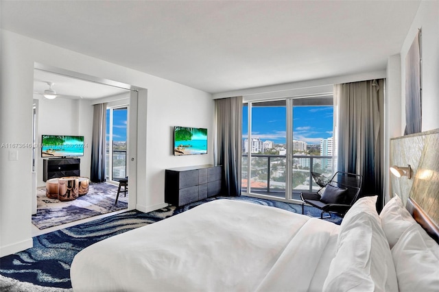 carpeted bedroom featuring access to exterior and multiple windows