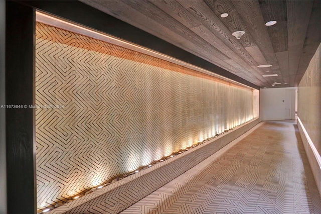 corridor with wood walls and wooden ceiling