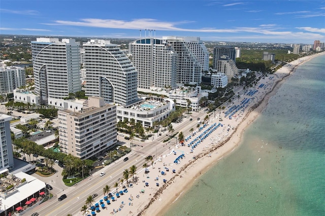 drone / aerial view featuring a view of the beach and a water view