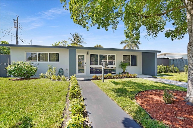 ranch-style house featuring a front lawn