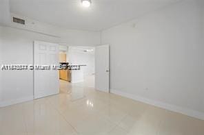 empty room featuring tile patterned floors