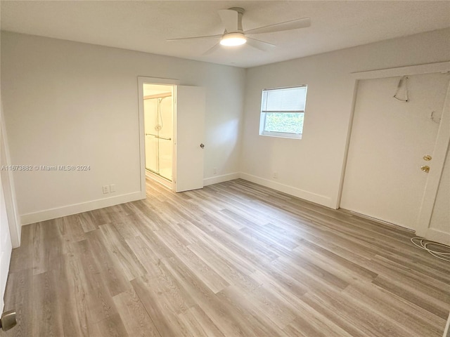 unfurnished bedroom with ceiling fan, a closet, and light hardwood / wood-style floors