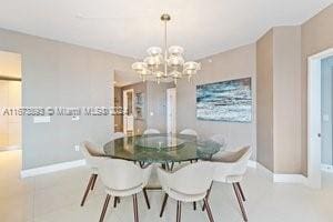 dining area featuring a notable chandelier