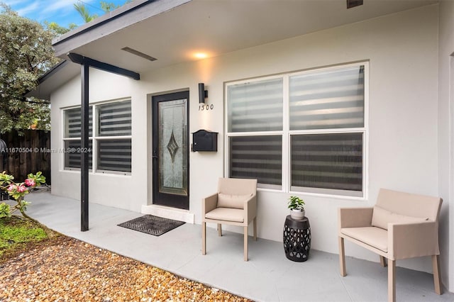 doorway to property with a patio