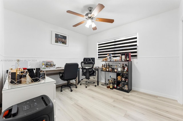 office space with ceiling fan and light hardwood / wood-style flooring