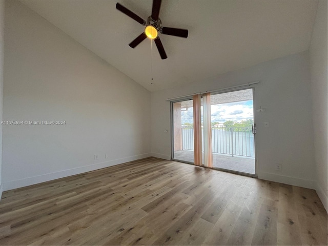 empty room featuring ceiling fan, high vaulted ceiling, and light hardwood / wood-style floors