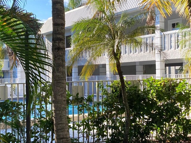 view of building exterior featuring a community pool