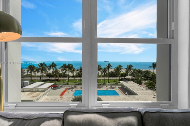 view of swimming pool with a water view