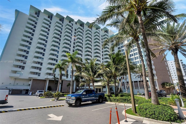 view of property featuring uncovered parking