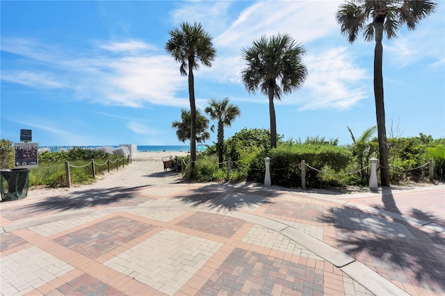 view of street with a water view and a view of the beach