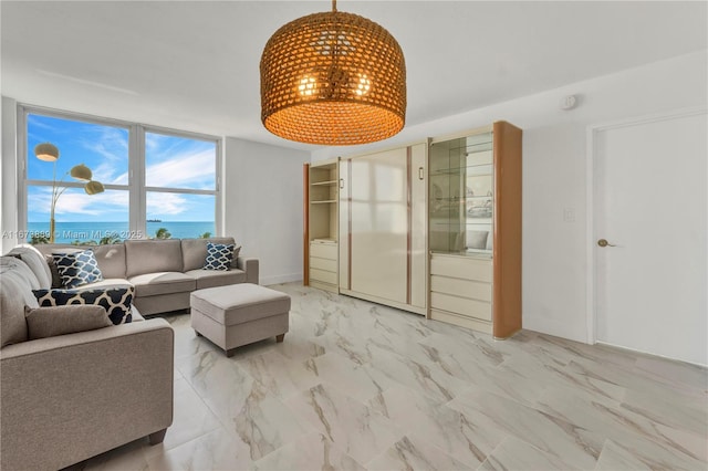 living area with marble finish floor and expansive windows