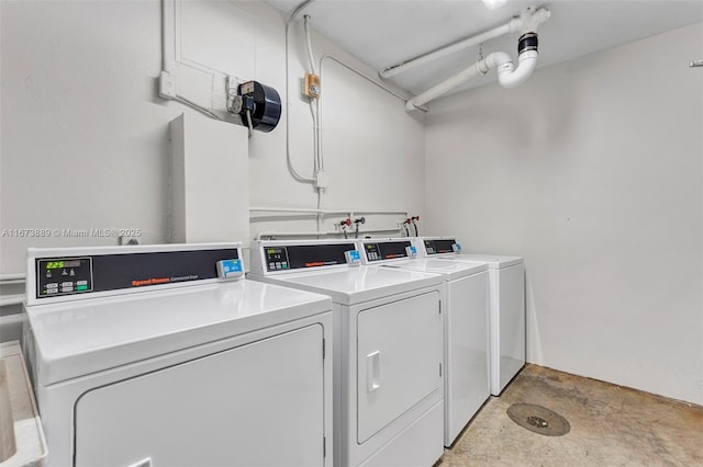 shared laundry area featuring washing machine and clothes dryer