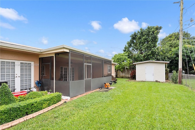 view of yard featuring a storage shed and a sunroom