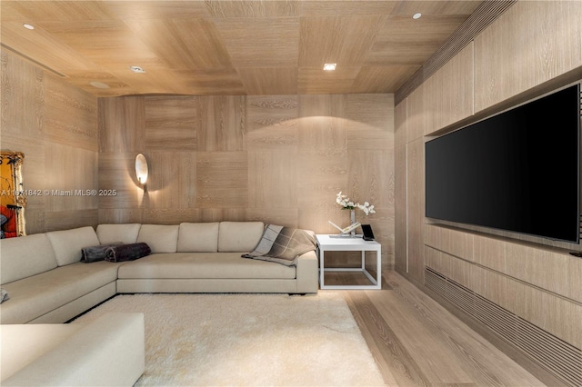 living room with wood ceiling and wooden walls