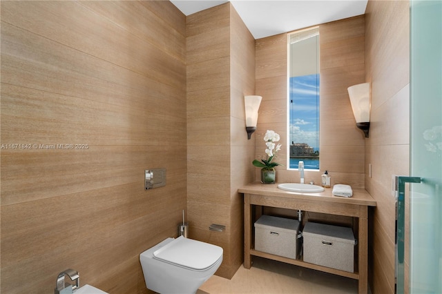 800 S Pointe Dr Unit 901, Miami Beach, FL 33139 - bathroom with a bidet, vanity, toilet, and tile walls