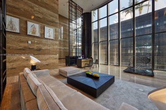 800 S Pointe Dr Unit 901, Miami Beach, FL 33139 - lobby featuring a towering ceiling, floor to ceiling windows, and wood walls