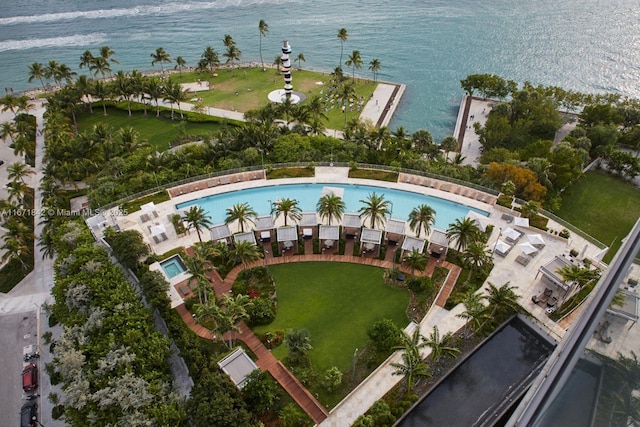 birds eye view of property with a water view