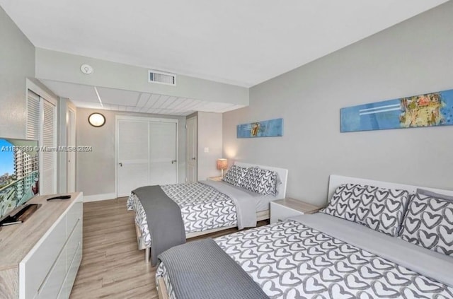 3801 S Ocean Dr Unit 9W, Hollywood, FL 33019 - bedroom with visible vents, light wood finished floors, and a closet