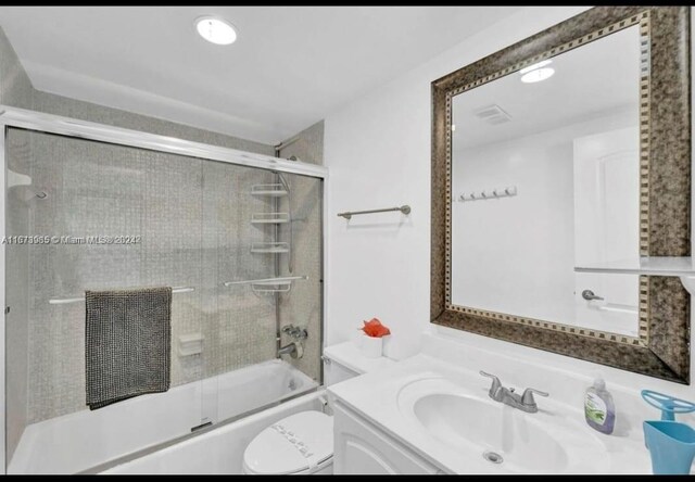 3801 S Ocean Dr Unit 9W, Hollywood, FL 33019 - full bathroom with vanity, combined bath / shower with glass door, and toilet