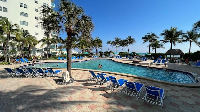 view of swimming pool featuring a patio area