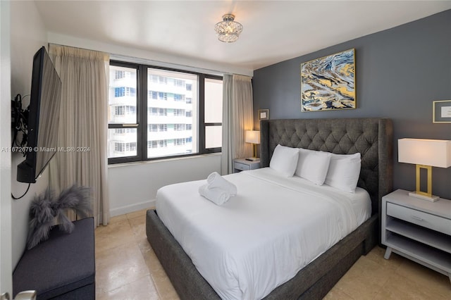 bedroom featuring light tile patterned flooring