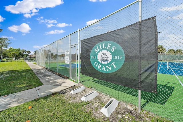 view of property's community with tennis court