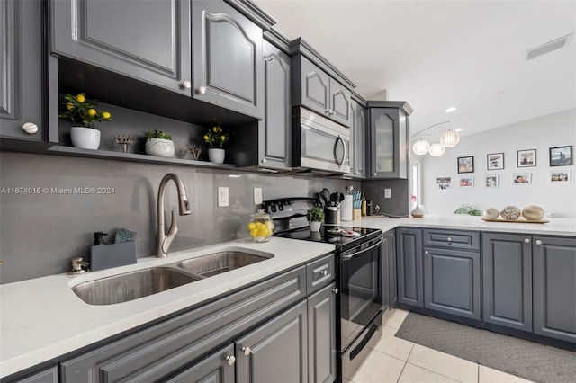 kitchen with black range with electric stovetop, gray cabinetry, sink, tasteful backsplash, and light tile patterned flooring