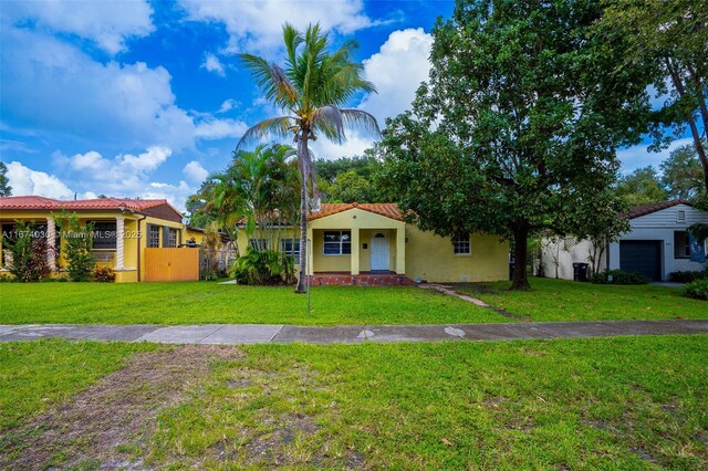 mediterranean / spanish-style house with a front lawn