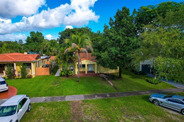 view of front of property with a front lawn