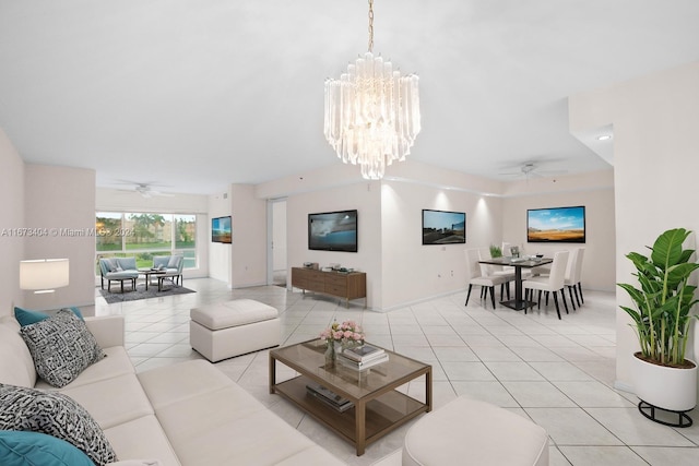 living room with ceiling fan with notable chandelier and light tile patterned floors