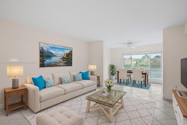 living room featuring light tile patterned floors and ceiling fan