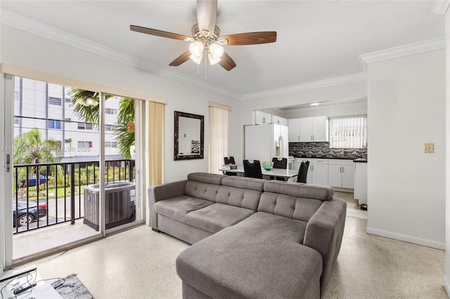 living room featuring ceiling fan and crown molding