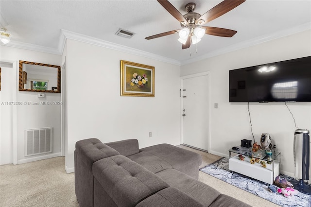 living room with ceiling fan and ornamental molding