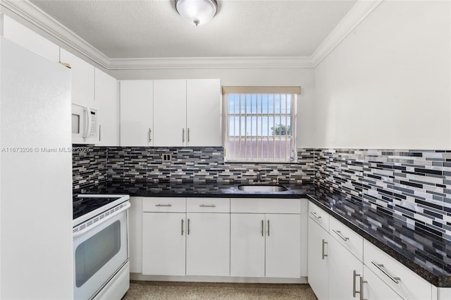 kitchen with white cabinetry, sink, dark stone counters, and white appliances