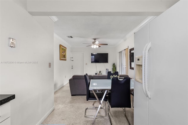 interior space featuring ceiling fan and crown molding