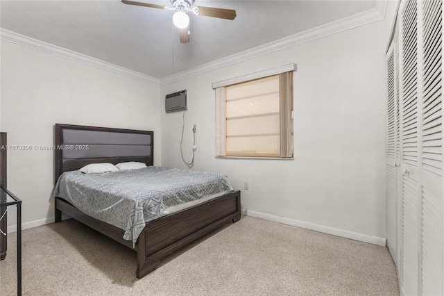 bedroom with ceiling fan, crown molding, a wall unit AC, and a closet