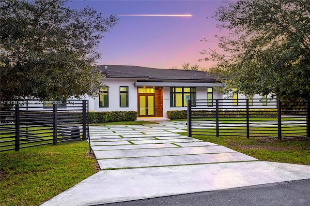 view of front of property with a yard