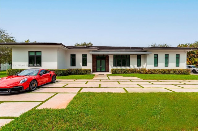 prairie-style house with a front lawn