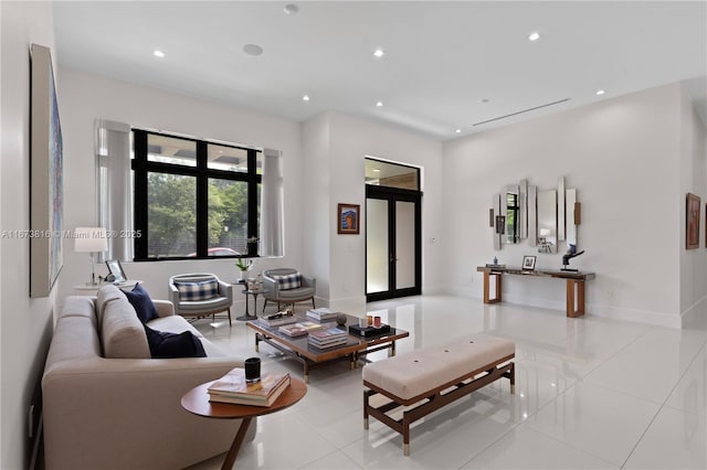 tiled living room featuring french doors