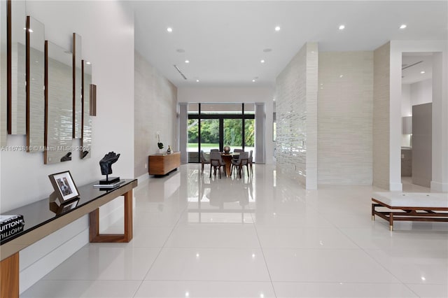 hall with light tile patterned flooring