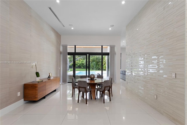 tiled dining area with tile walls