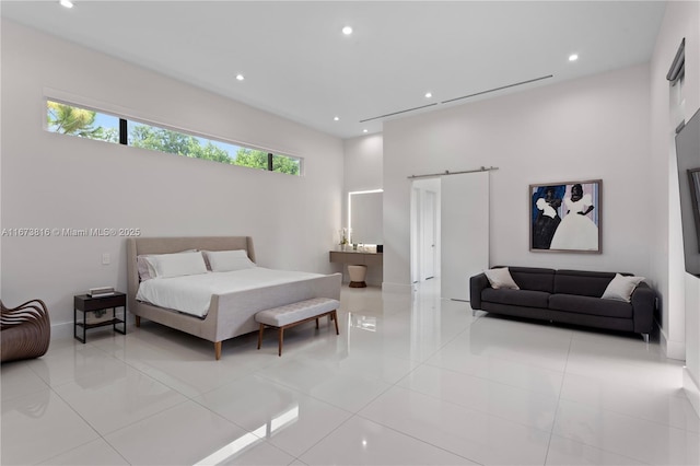 tiled bedroom with a barn door