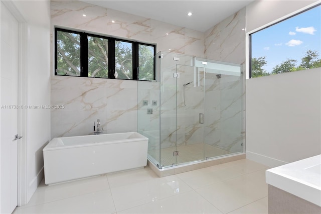 bathroom featuring plus walk in shower and tile patterned floors