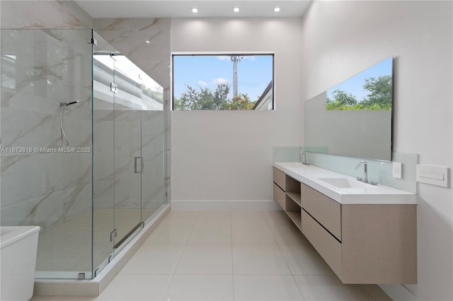 bathroom with vanity, tile patterned floors, and a shower with shower door