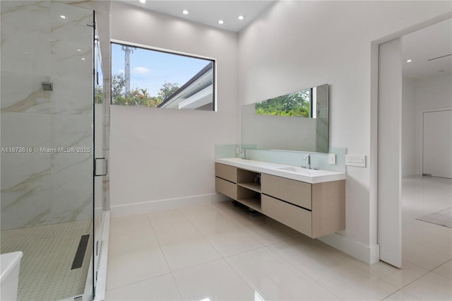 bathroom with tile patterned floors, vanity, and a shower with shower door