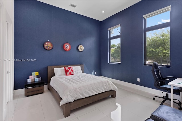 bedroom featuring light tile patterned floors