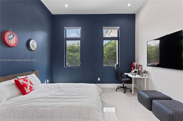 bedroom with light tile patterned floors