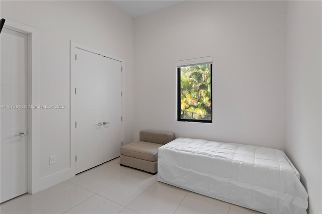 bedroom featuring light tile patterned floors