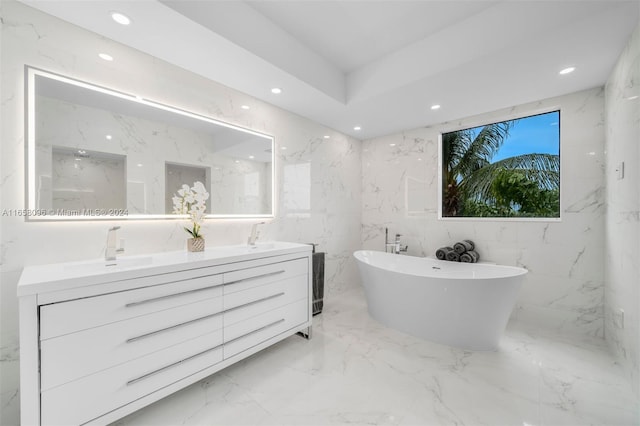 bathroom with vanity, independent shower and bath, and tile walls